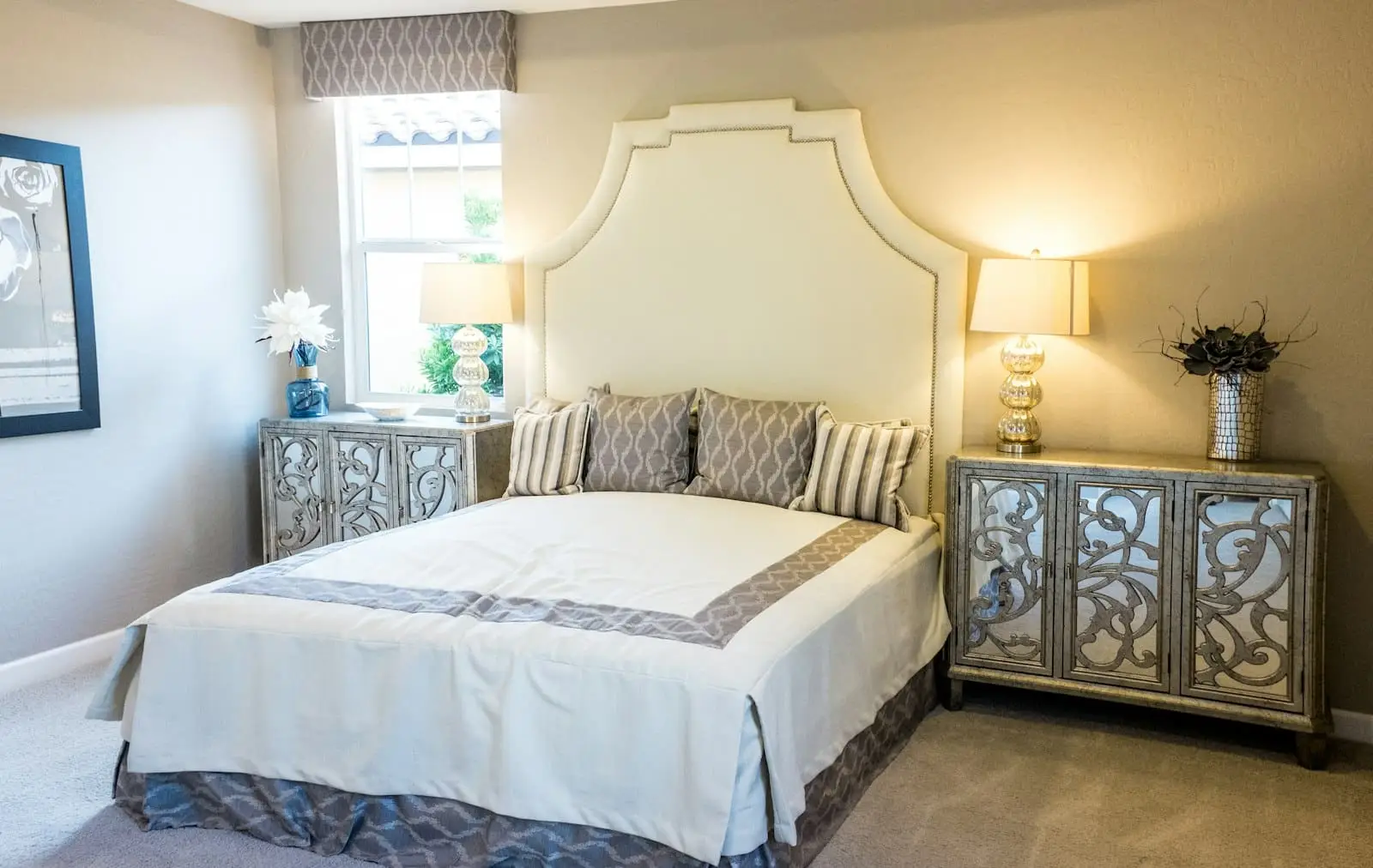 Elegant bedroom suite with sitting area and natural light, the true-suite standard for every generation in a multi-generational luxury home