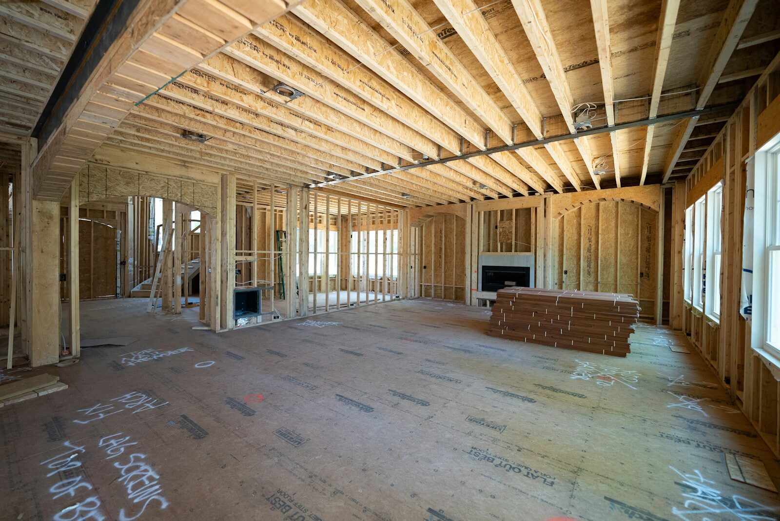 Integrating Smart Systems in Luxury Homes - 1 a room with a wood floor and a bench