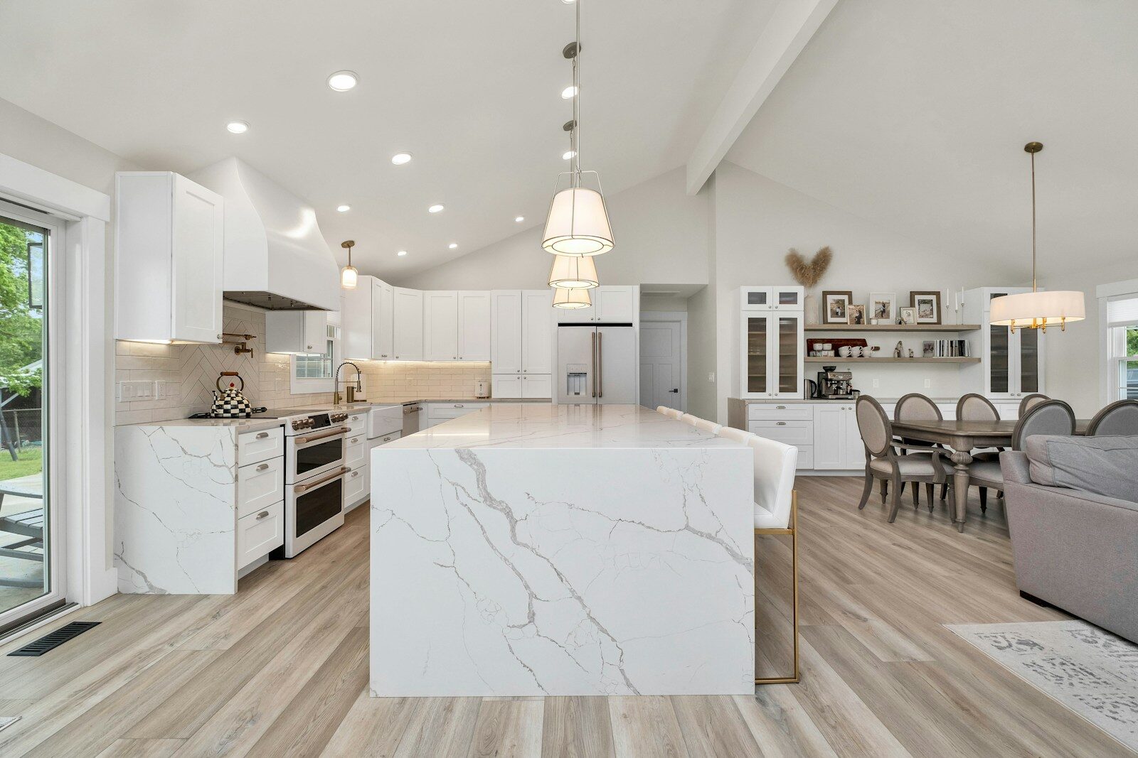 Cost per Square Foot Luxury Homes - 6 a large kitchen with a center island in the middle of the room