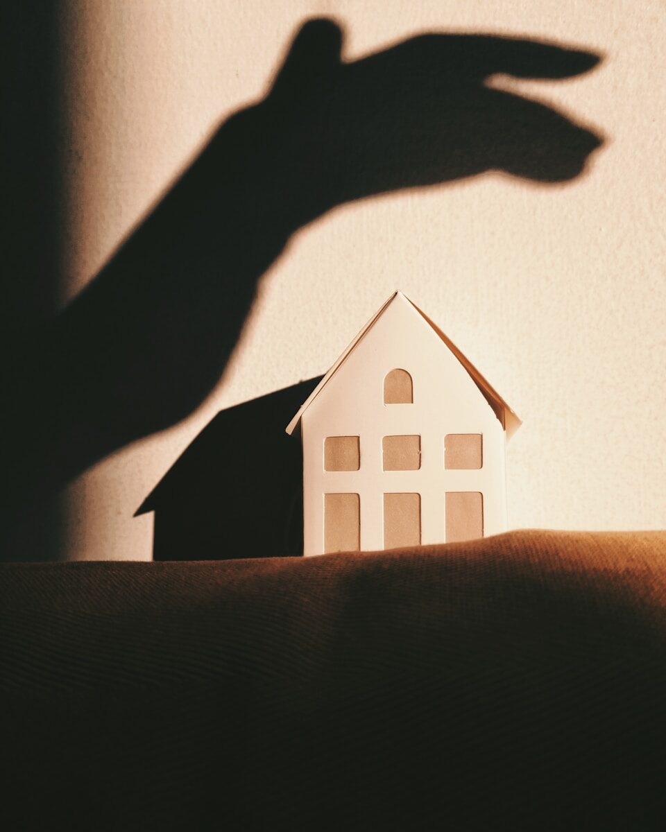 Advanced Home Security & Surveillance for High-Net-Worth Properties - 2 white and brown house on brown textile
