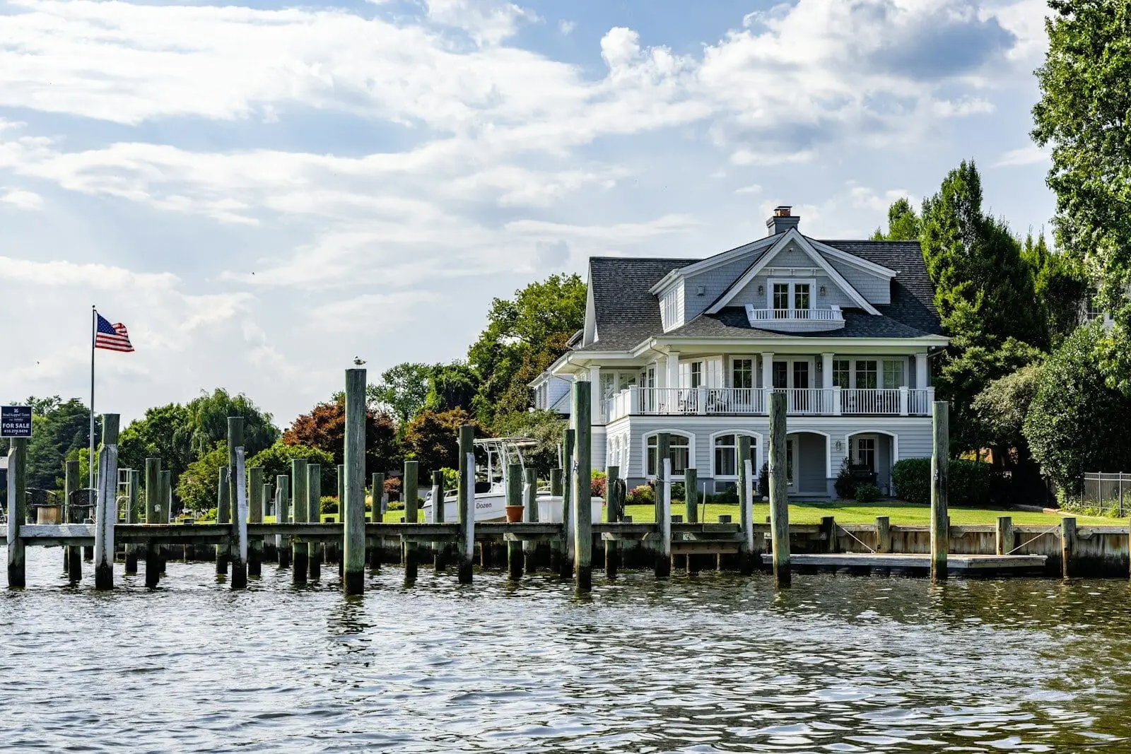 Large waterfront home with a private dock, the kind of South Florida luxury lifestyle property where buyers now ask about seawall condition and dock readiness first