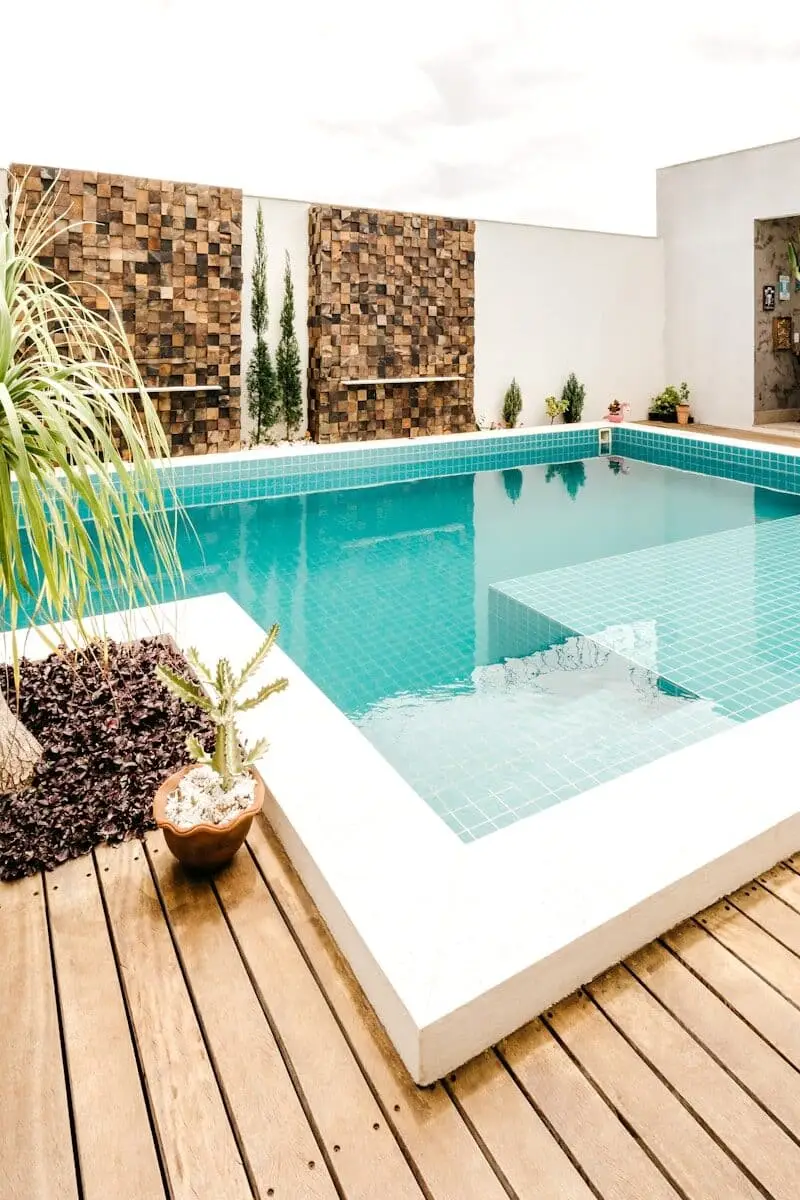 Potted native greenery beside a luxury pool deck in South Florida