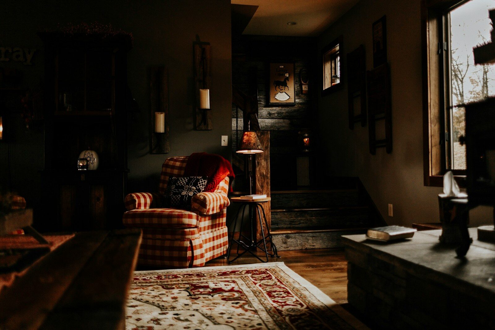 Feasibility Study for Luxury Home Builds: When to Tear Down vs. Renovate - 1 red and white checkered armchair beside rack