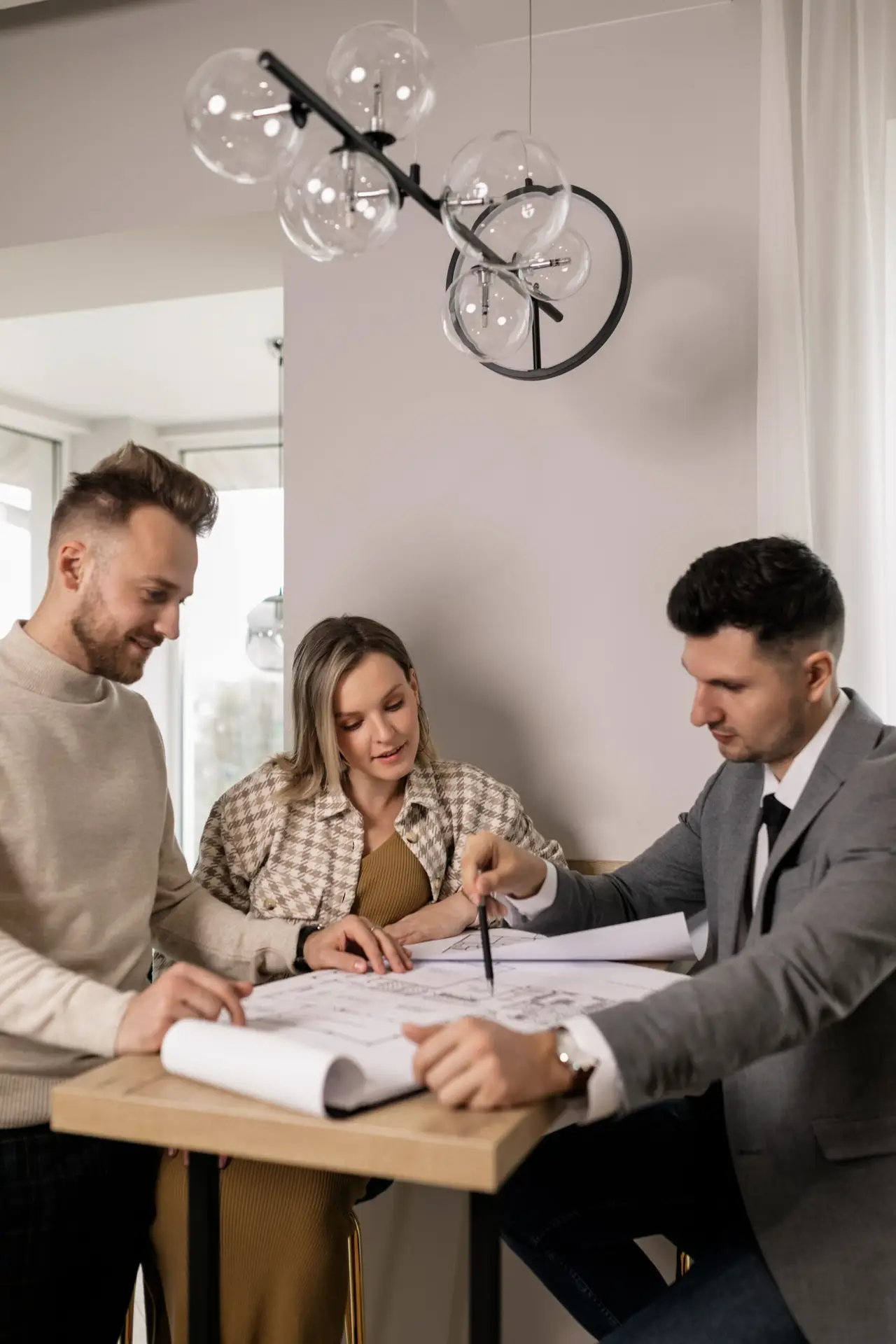Owners and builder reviewing a budget luxury home build line by line