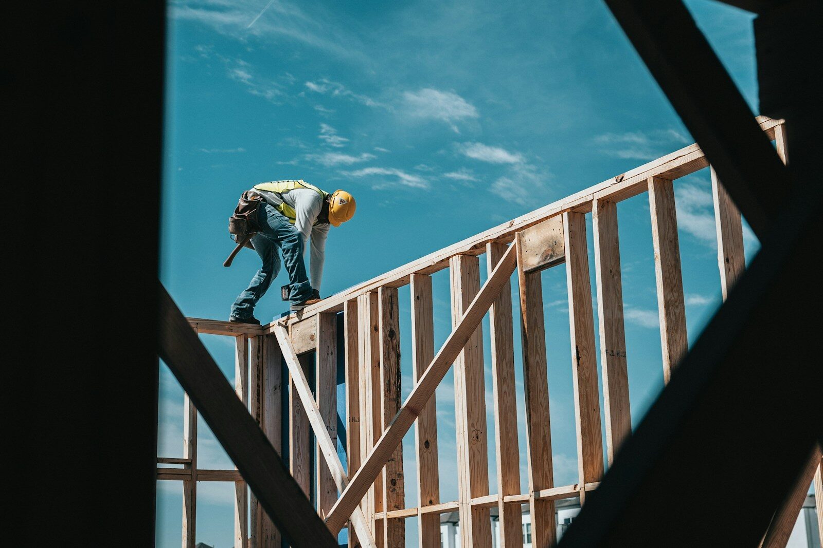 Contingency Planning for Supply Chain Issues in Luxury Construction - 2 construction worker in hard hat on building frame