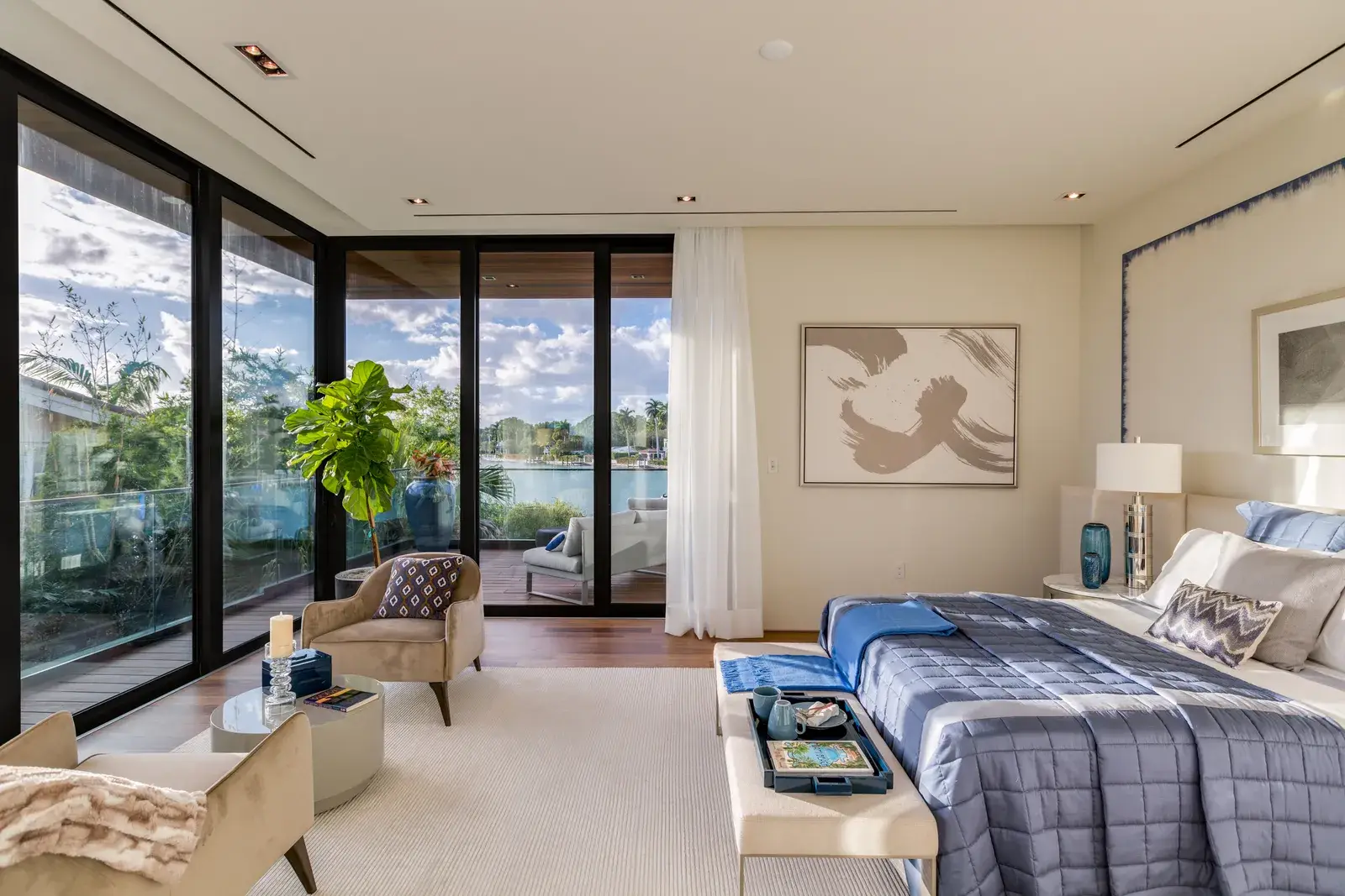 Dual primary suites in a multi-generational luxury home, each with its own sitting area and outdoor access